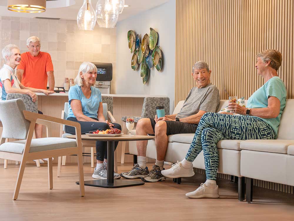 A group of seniors seated at the gym health bar at Plymouth Harbor on Sarasota Bay