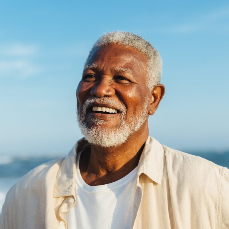 A resident smiling in front of the bay.